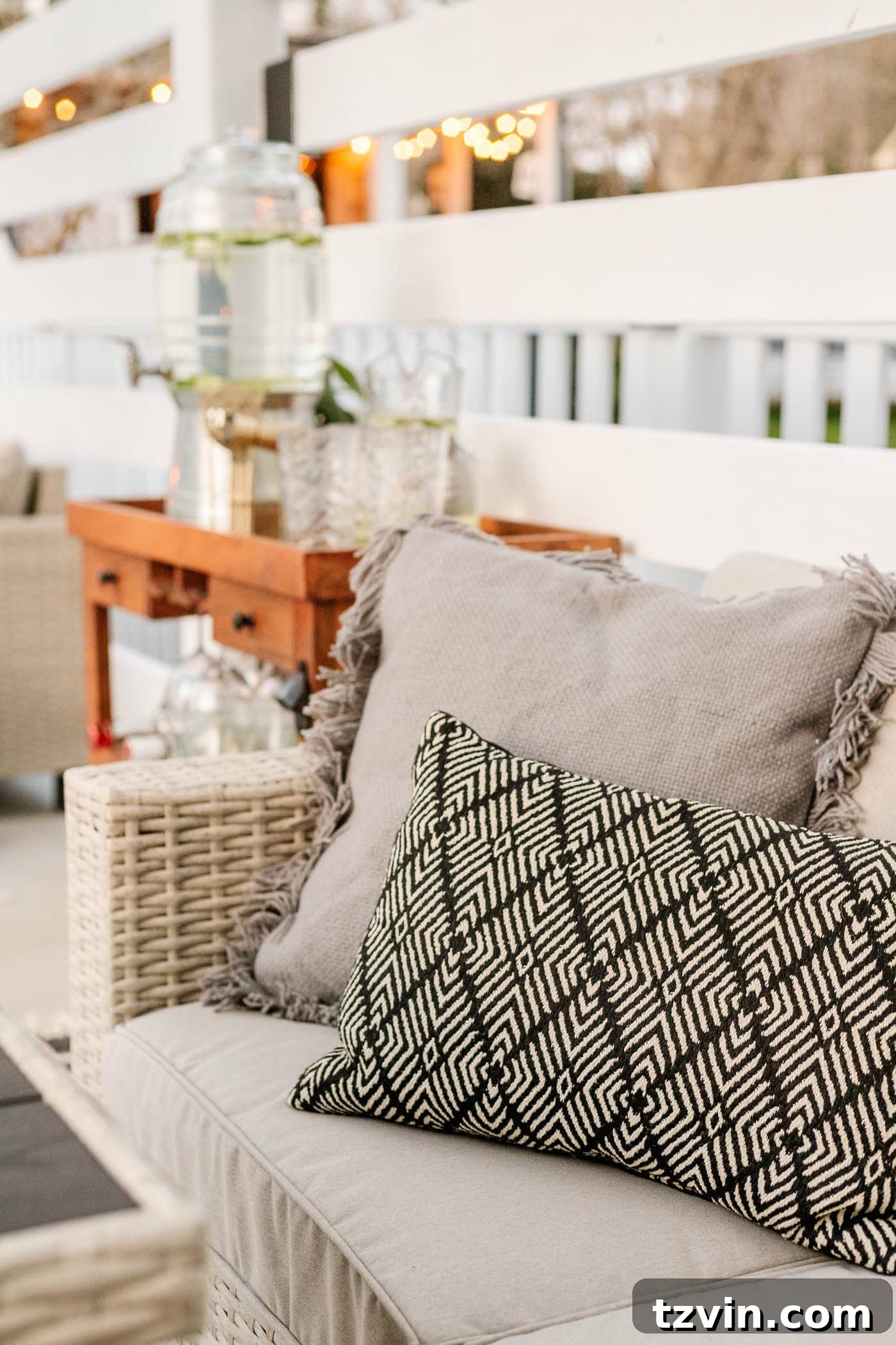 Stylish outdoor pillows adding comfort and aesthetic to the patio furniture, maintaining a neutral and versatile palette