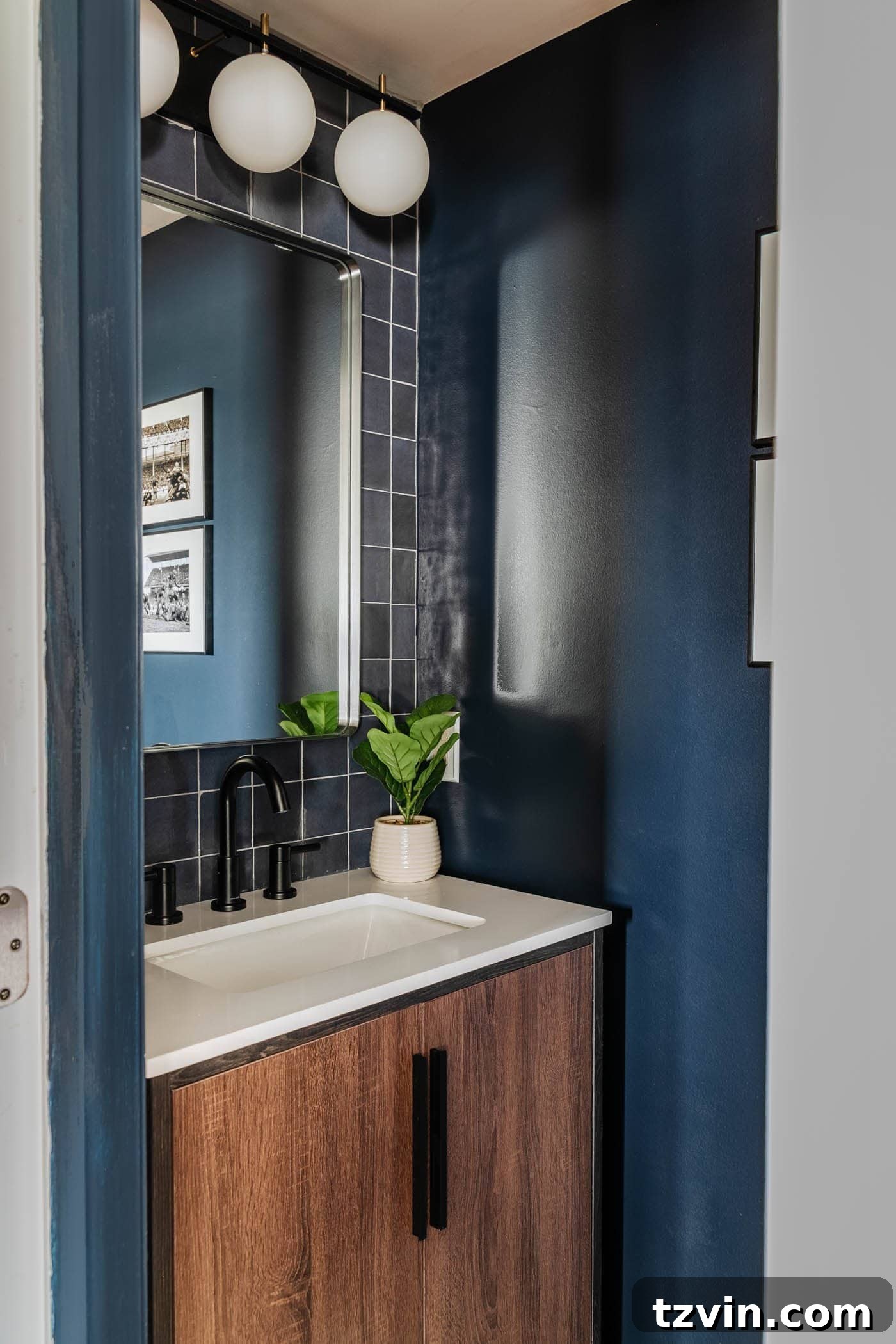 Sleek Compact Powder Room for the Modern Gentleman 10 stacked tile focal wall behind a vanity in a small bathroom at a bachelor pad