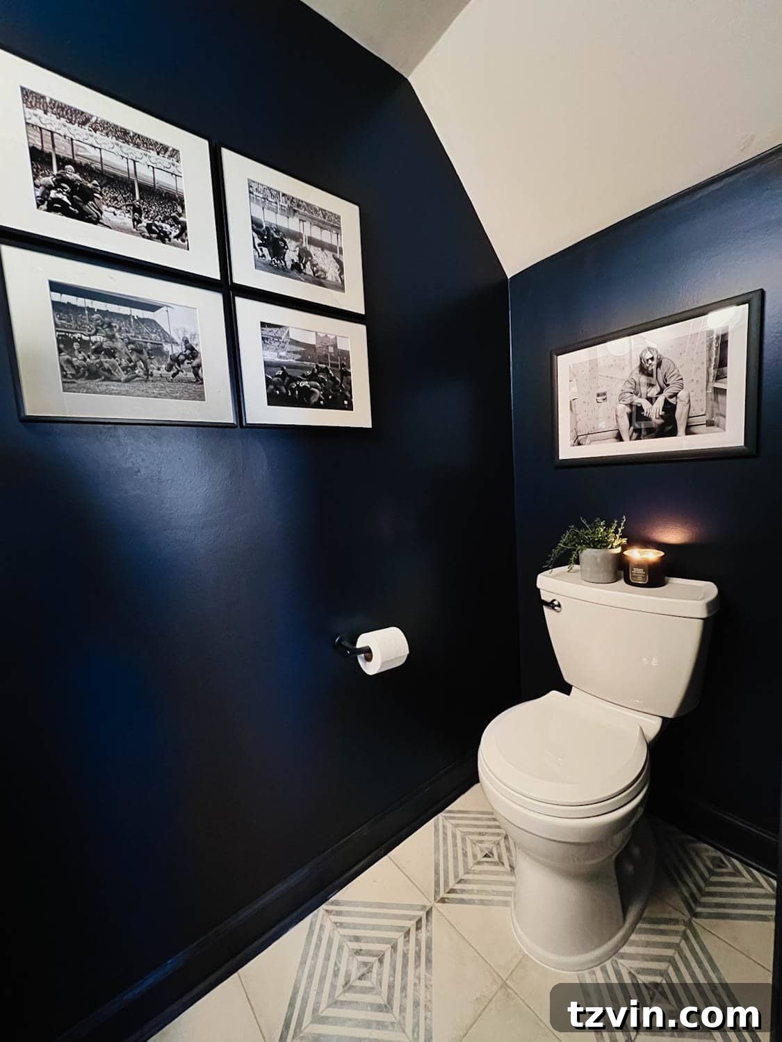 Sleek Compact Powder Room for the Modern Gentleman 4 Benjamin Moore Polo Blue walls in a small powder room with masculine black and white art