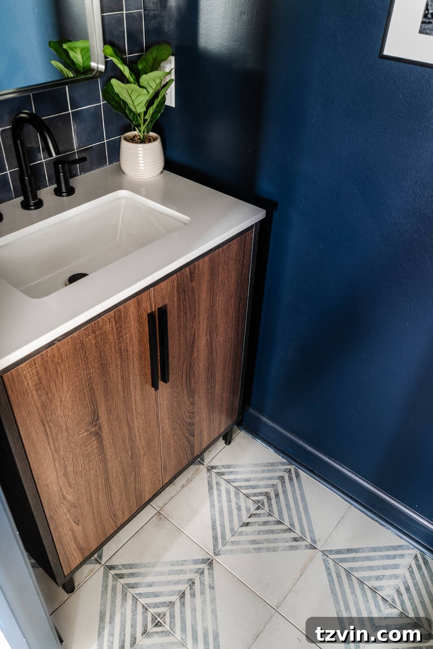 Sleek Compact Powder Room for the Modern Gentleman 9 patterned tile and wood vanity with navy blue walls