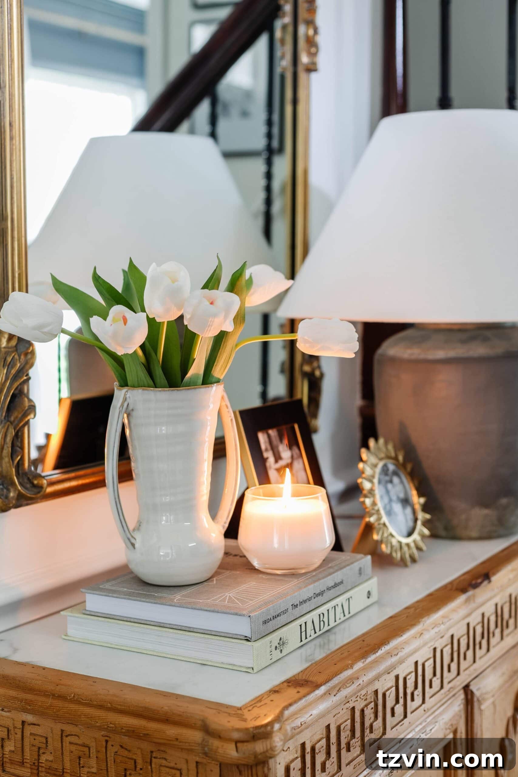 Faux Flowers So Realistic They Fool Everyone 4 fake tulips on a tabletop with books and candle