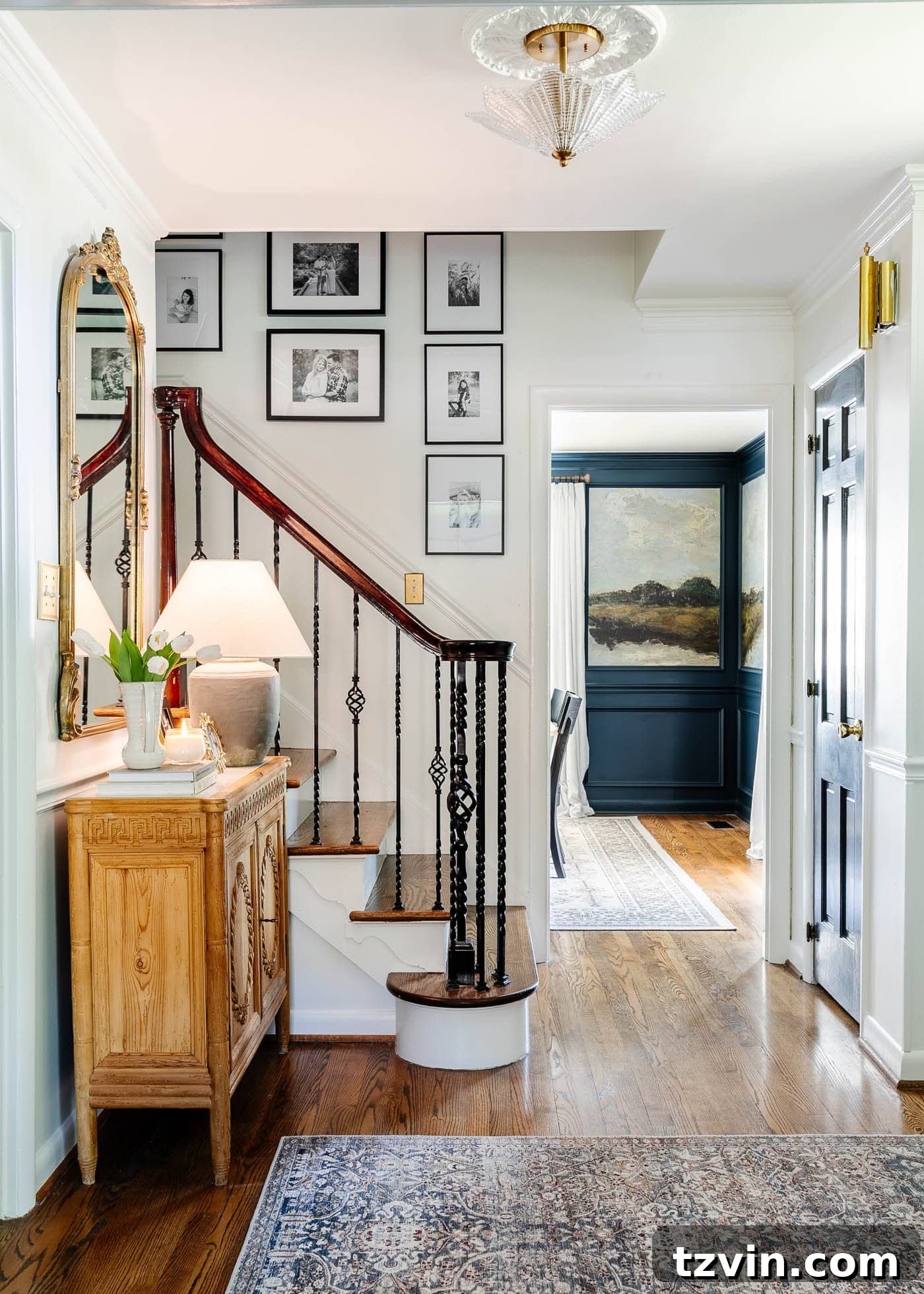 Mastering Your Entry Table Decor A Pros Step-by-Step Guide 2 foyer with entry chest, mirror, and stairway gallery wall