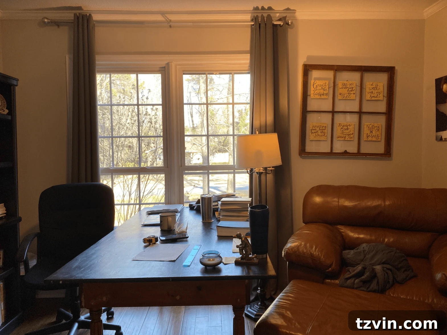 Designing the Future: Our Next Project's Workspace Mood Board 2 Before photo of a home office with a large desk and chair, showing natural light from a double window.