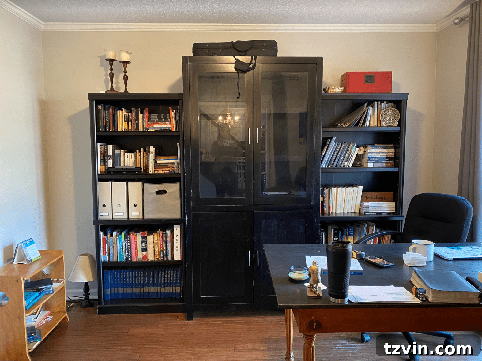 Designing the Future: Our Next Project's Workspace Mood Board 4 Before photo of built-in shelving in a home office, showing potential for better space utilization.