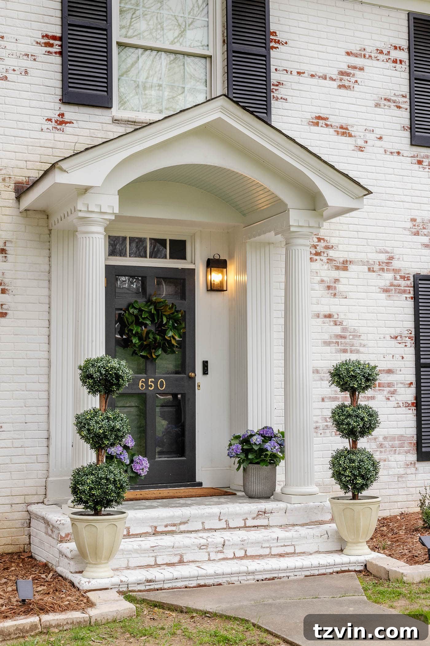 Transform Your Small Porch on a Dime 11 limewash brick steps on a colonial house with small porch decor using symmetrical planters
