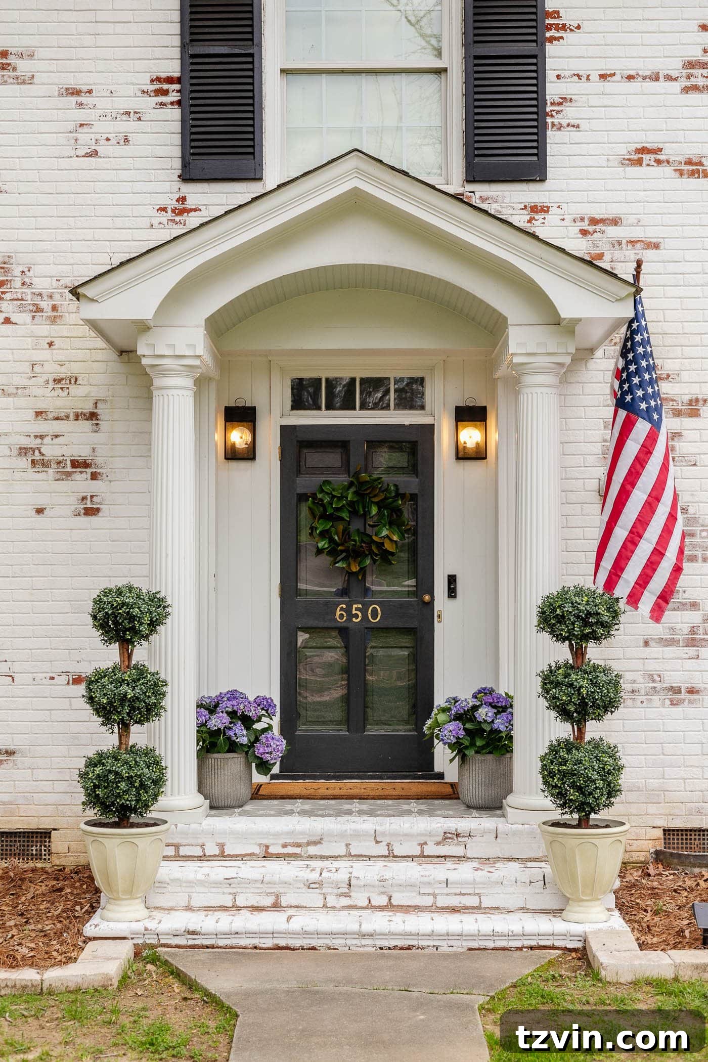 Transform Your Small Porch on a Dime 7 colonial small front porch on a limewashed brick house with boxwood topiaries and hydrangeas in planters