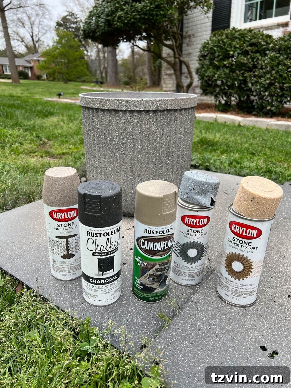 faux DIY concrete planters made with different neutral colors of leftover spray paint