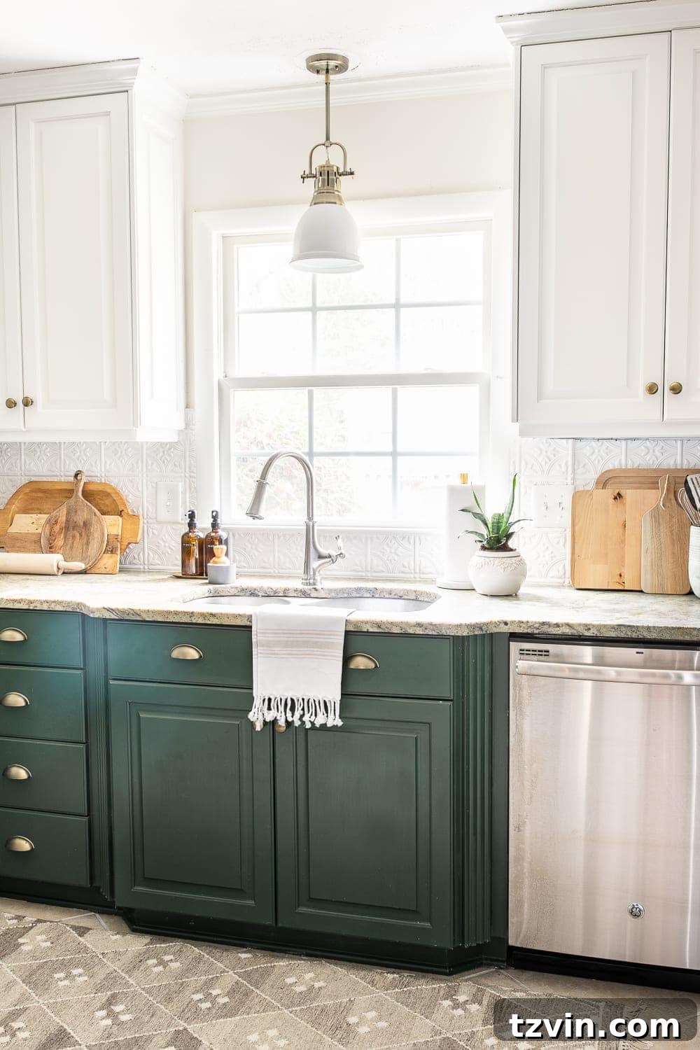 30 Budget Secrets to a Million-Dollar Home Aesthetic 26 white pressed tin backsplash in a kitchen with white and green cabinets