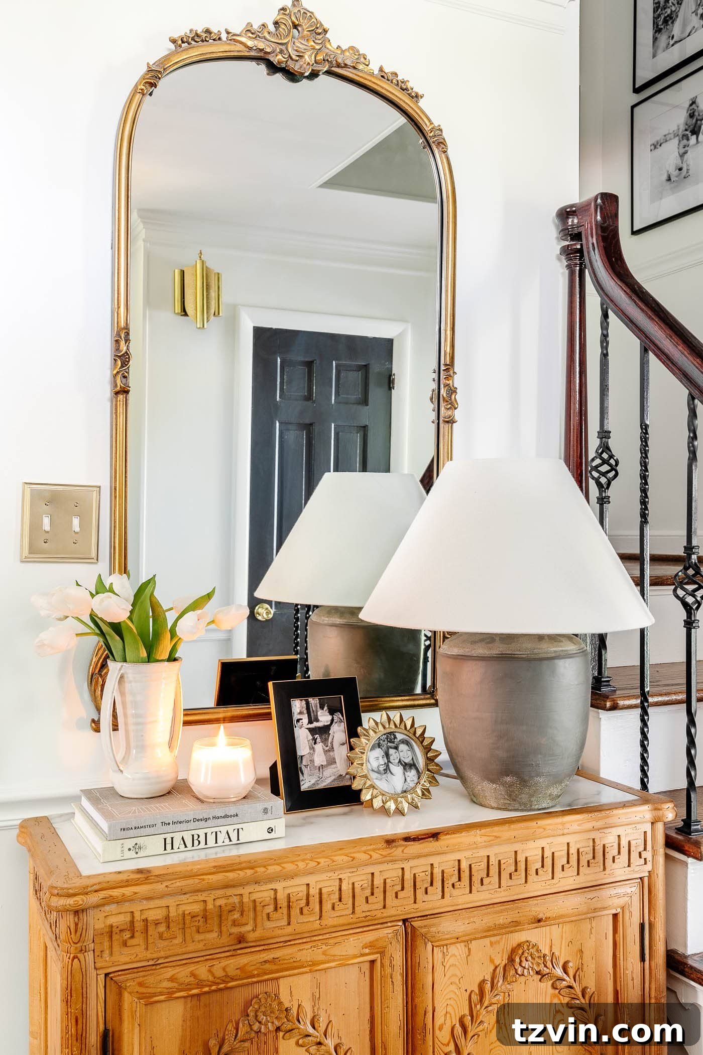 30 Budget Secrets to a Million-Dollar Home Aesthetic 29 antique gold mirror in an entryway above foyer chest