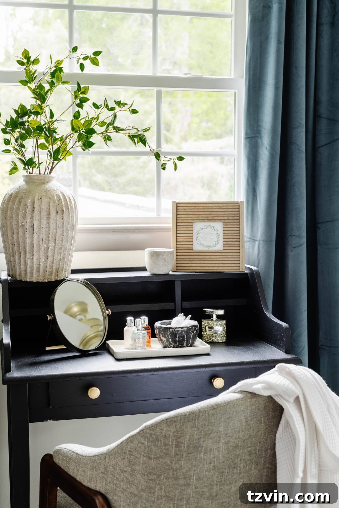 guest bedroom vanity in front of window