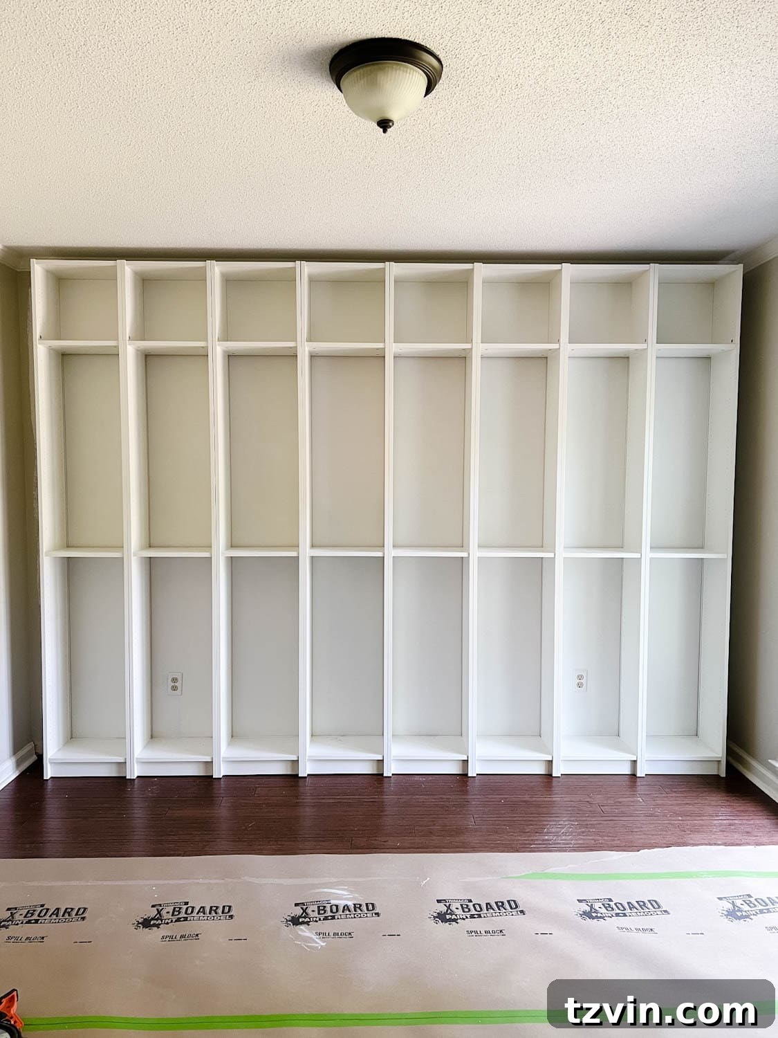 Building Custom Bookshelves with IKEA Billy Bookcase Hacks 12 attached and anchored bookcases to the wall to make DIY built in bookshelves