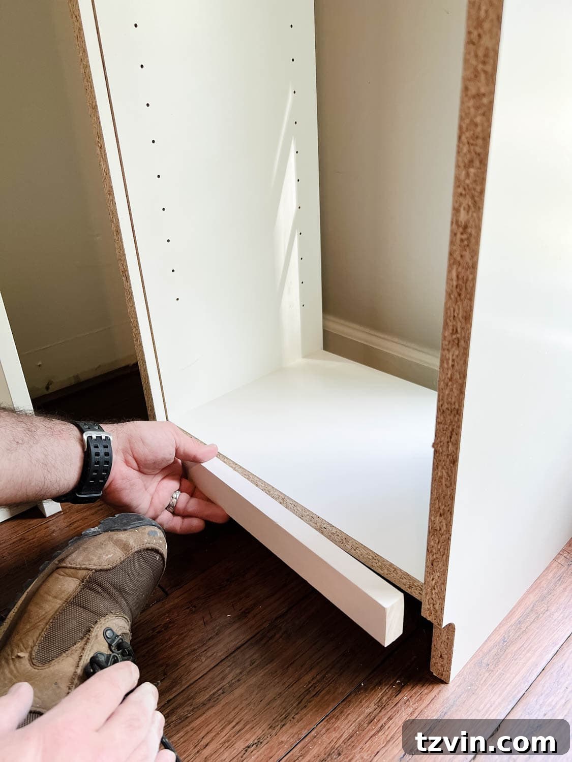 Building Custom Bookshelves with IKEA Billy Bookcase Hacks 7 adding a 1x2 to the back of a bookcase to fill a gap to make diy built in bookshelves