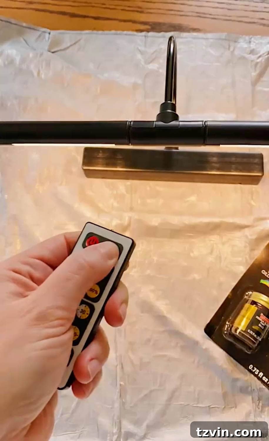 Setting timer with a remote on a wireless picture light, highlighting ease of use