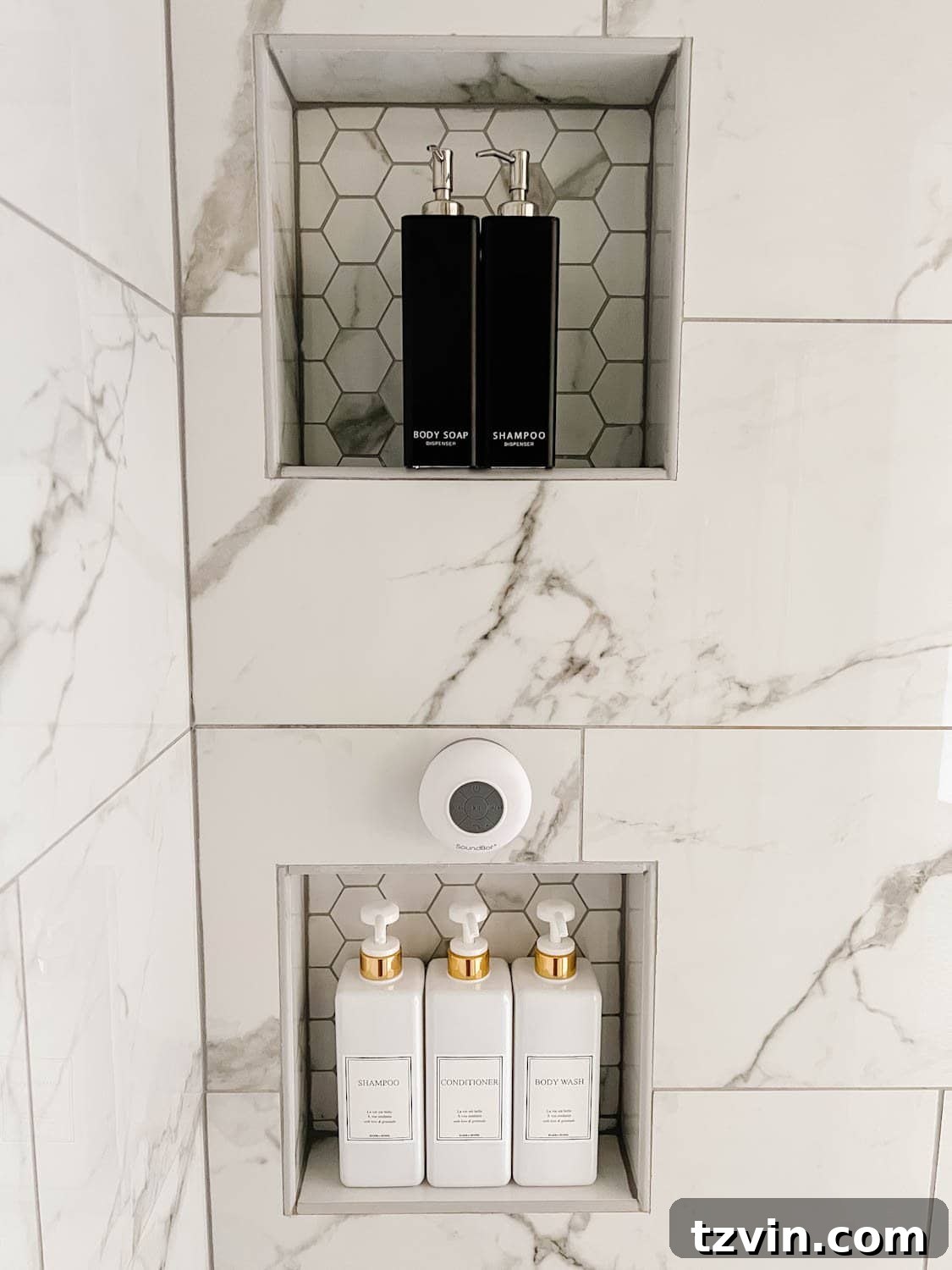 Attainable Luxury: Spa Bathroom Ideas for Every Home 5 shower dispenser set in shower niche with waterproof bluetooth speaker