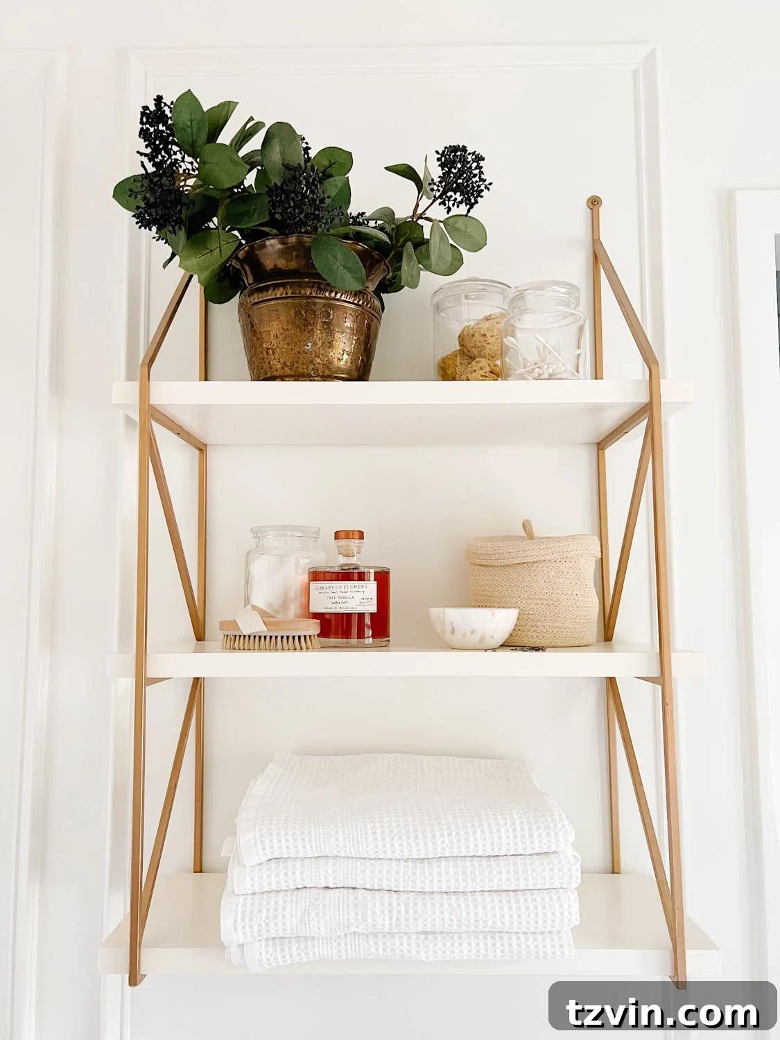 Attainable Luxury: Spa Bathroom Ideas for Every Home 9 open shelving in a bathroom with apothecary jars and waffle weave towels