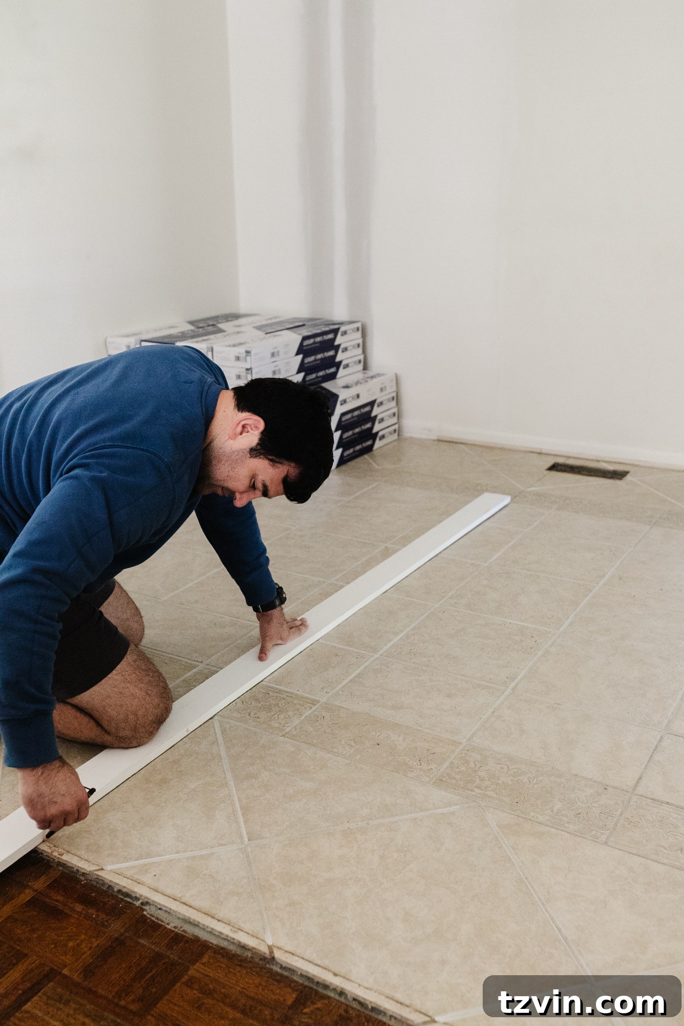 marking the starting line to install LVP floating floor over tile