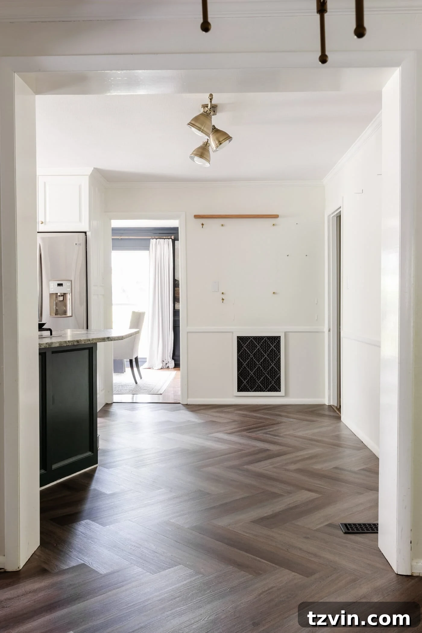 finished ProCore Floor herringbone LVP floating floor over tile in a kitchen