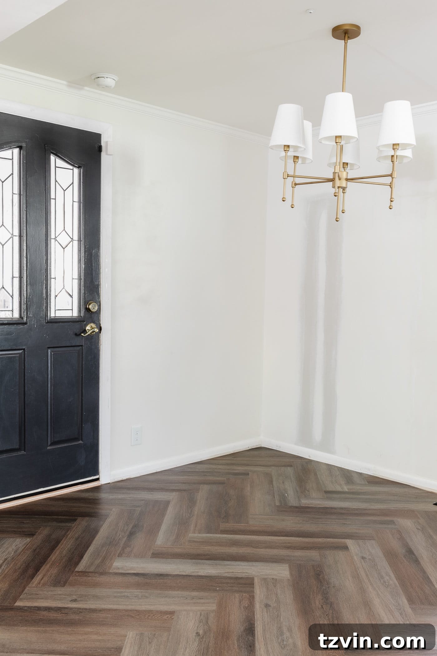 finished herringbone LVP floating floor installation in a breakfast nook
