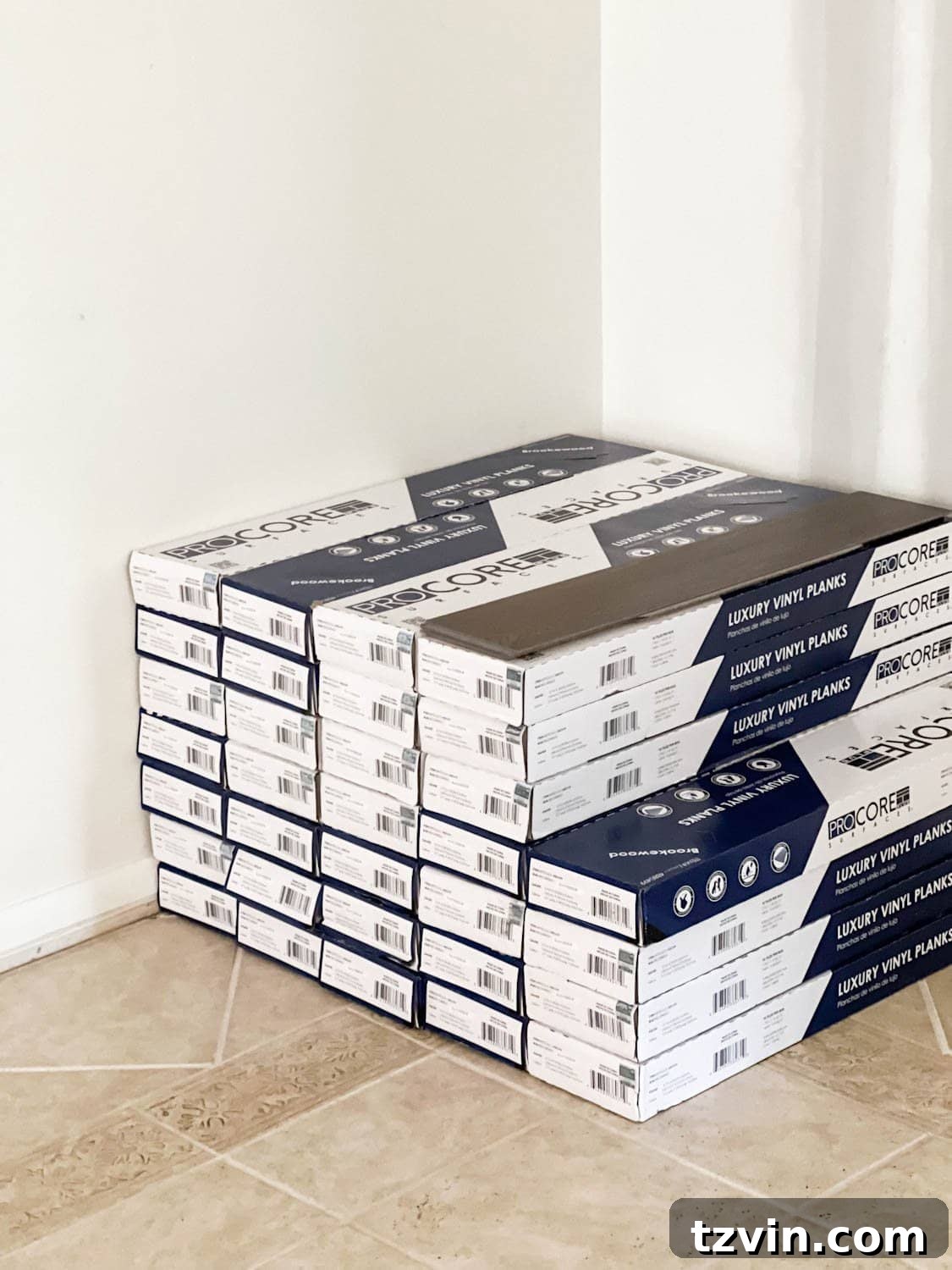 stack of ProCore Floors luxury vinyl plank floors on top of tile