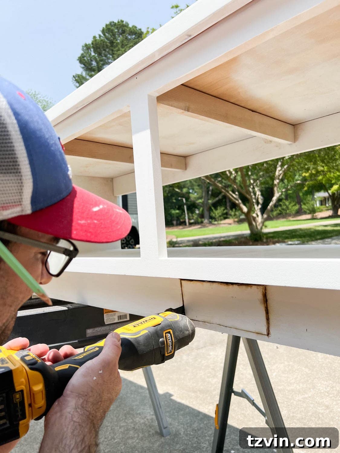cutting a hole with an oscillating tool for an air vent redirect under a built in banquette