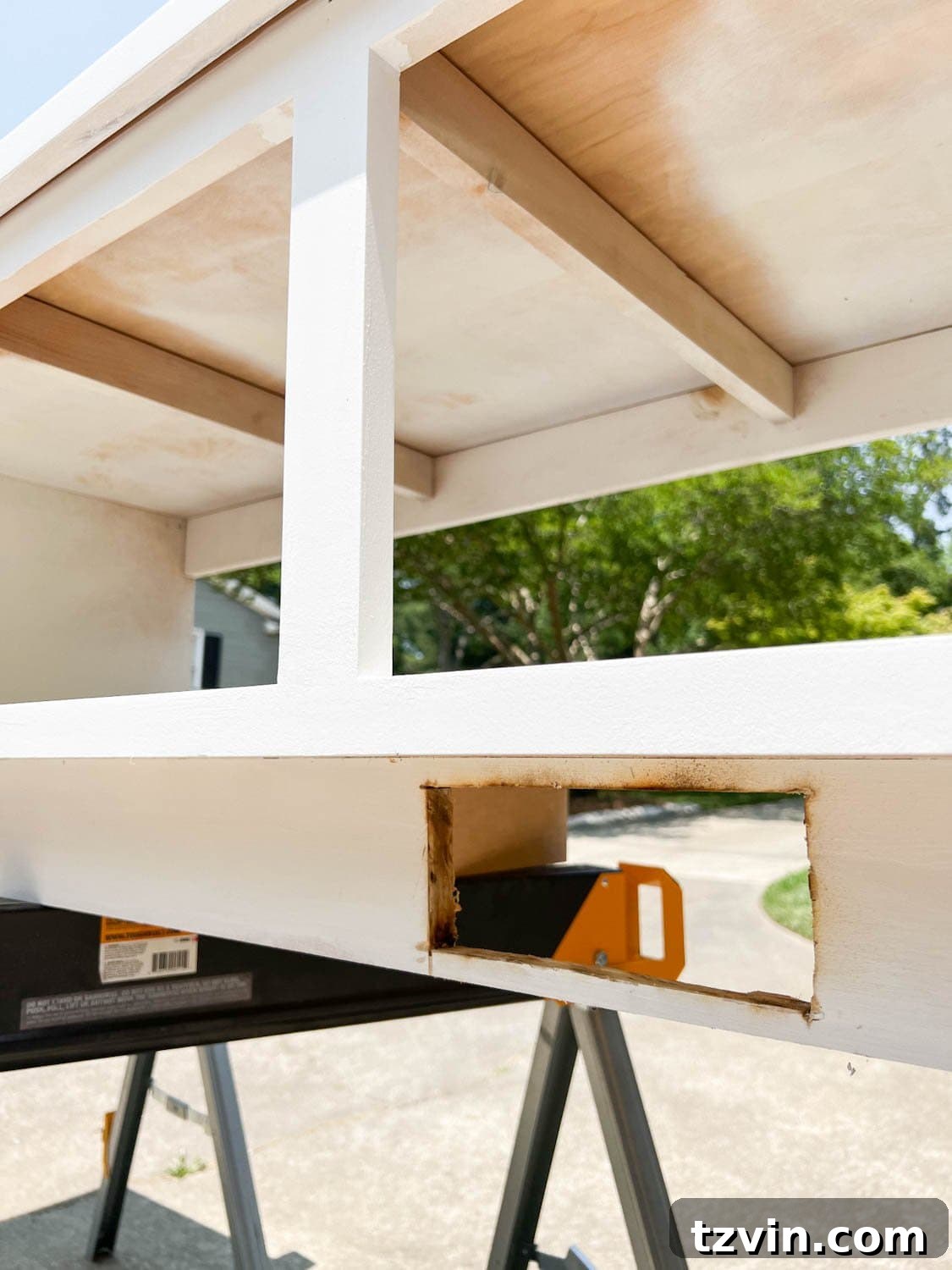 hole cut for an air vent redirect under a banquette bench