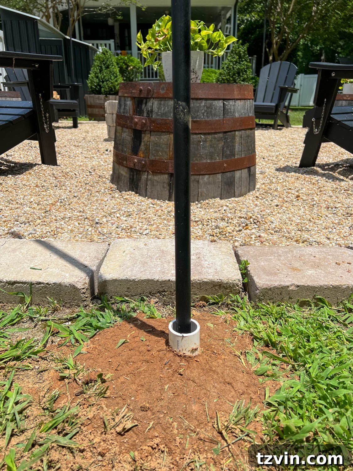 Creative String Light Solutions for Every Backyard Corner 18 DIY string light pole in the ground with PVC pipe to anchor it