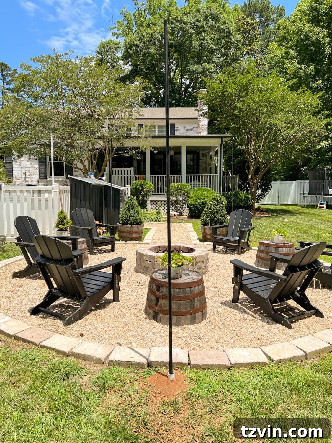 Creative String Light Solutions for Every Backyard Corner 19 DIY string light poles around a fire pit made of conduit and PVC pipe