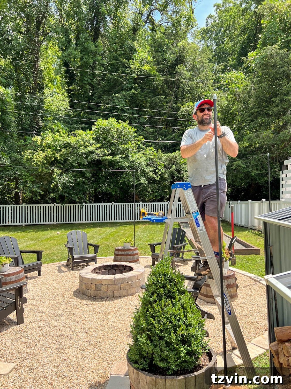 Creative String Light Solutions for Every Backyard Corner 23 attaching a cable system to DIY string light poles for stability
