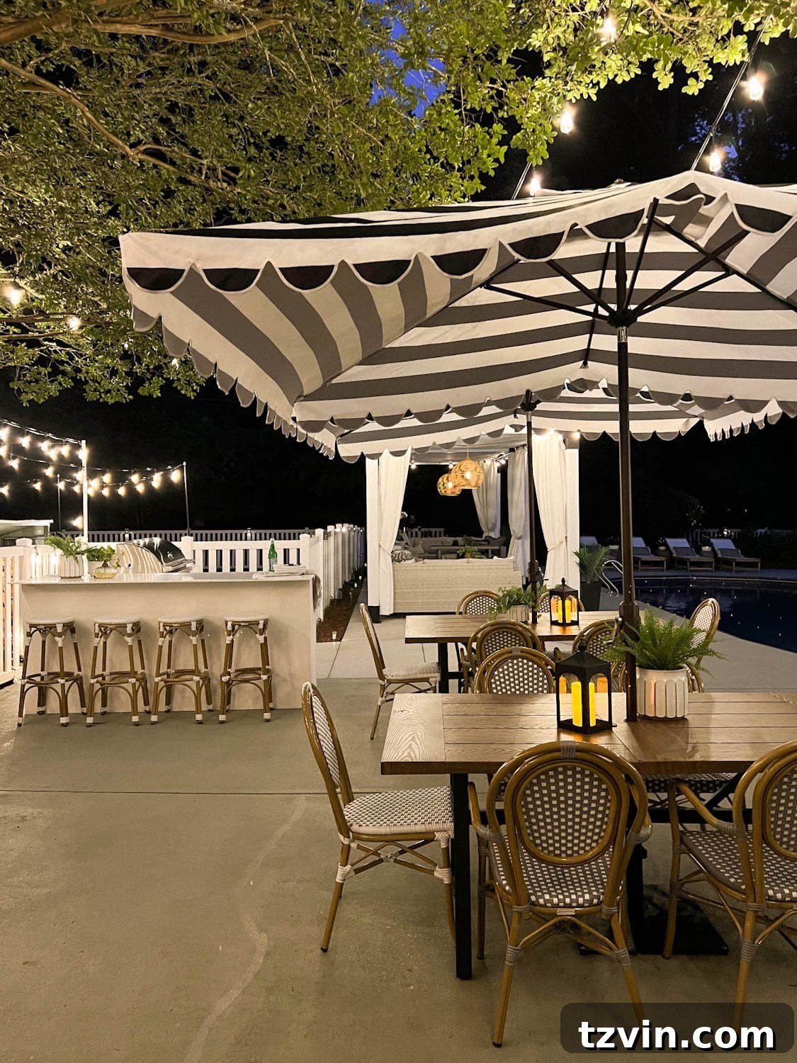 Creative String Light Solutions for Every Backyard Corner 31 outdoor dining tables and outdoor kitchen with string lights overhead