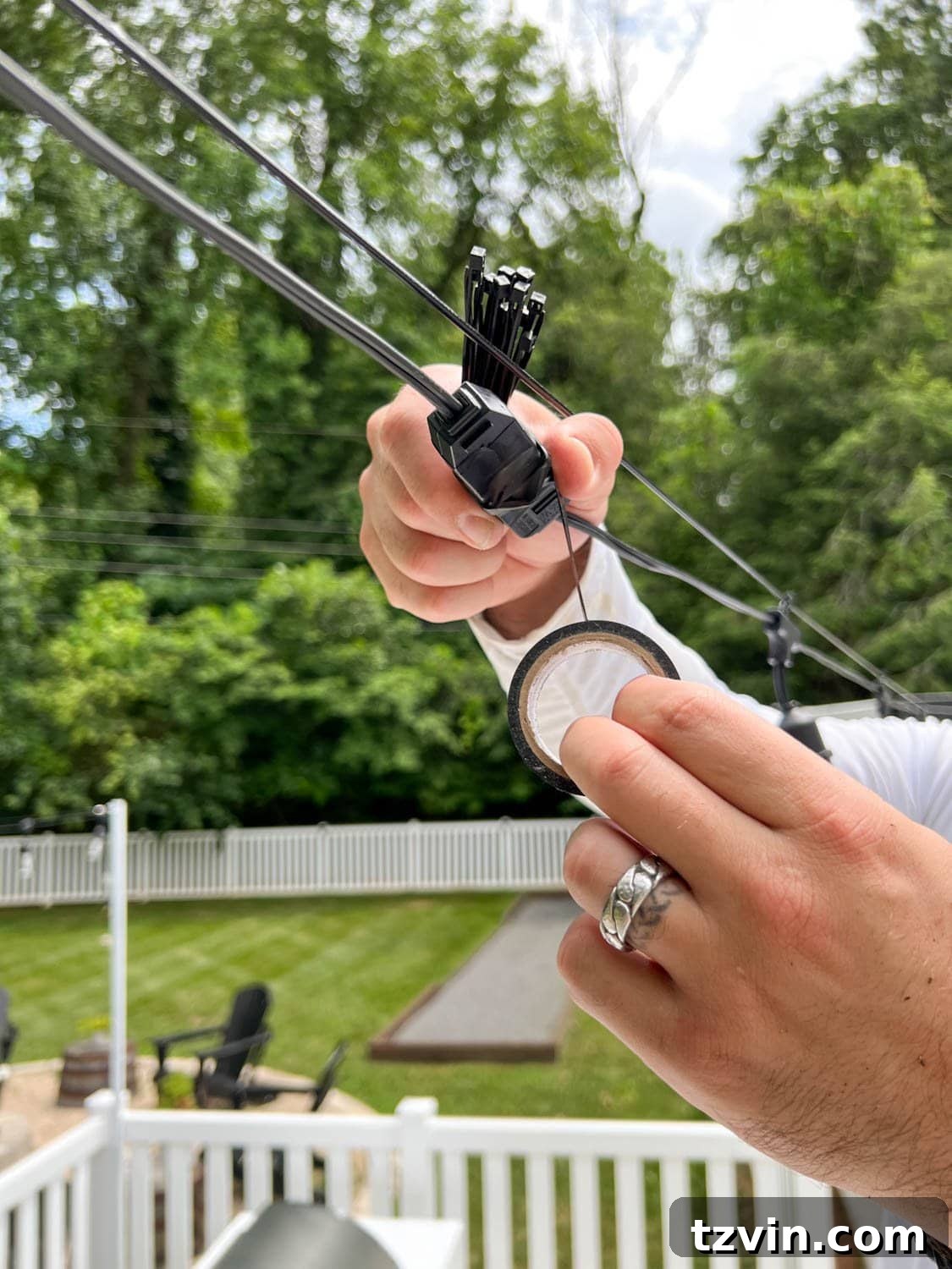 Creative String Light Solutions for Every Backyard Corner 45 wrapping light plugs with black electrical tape