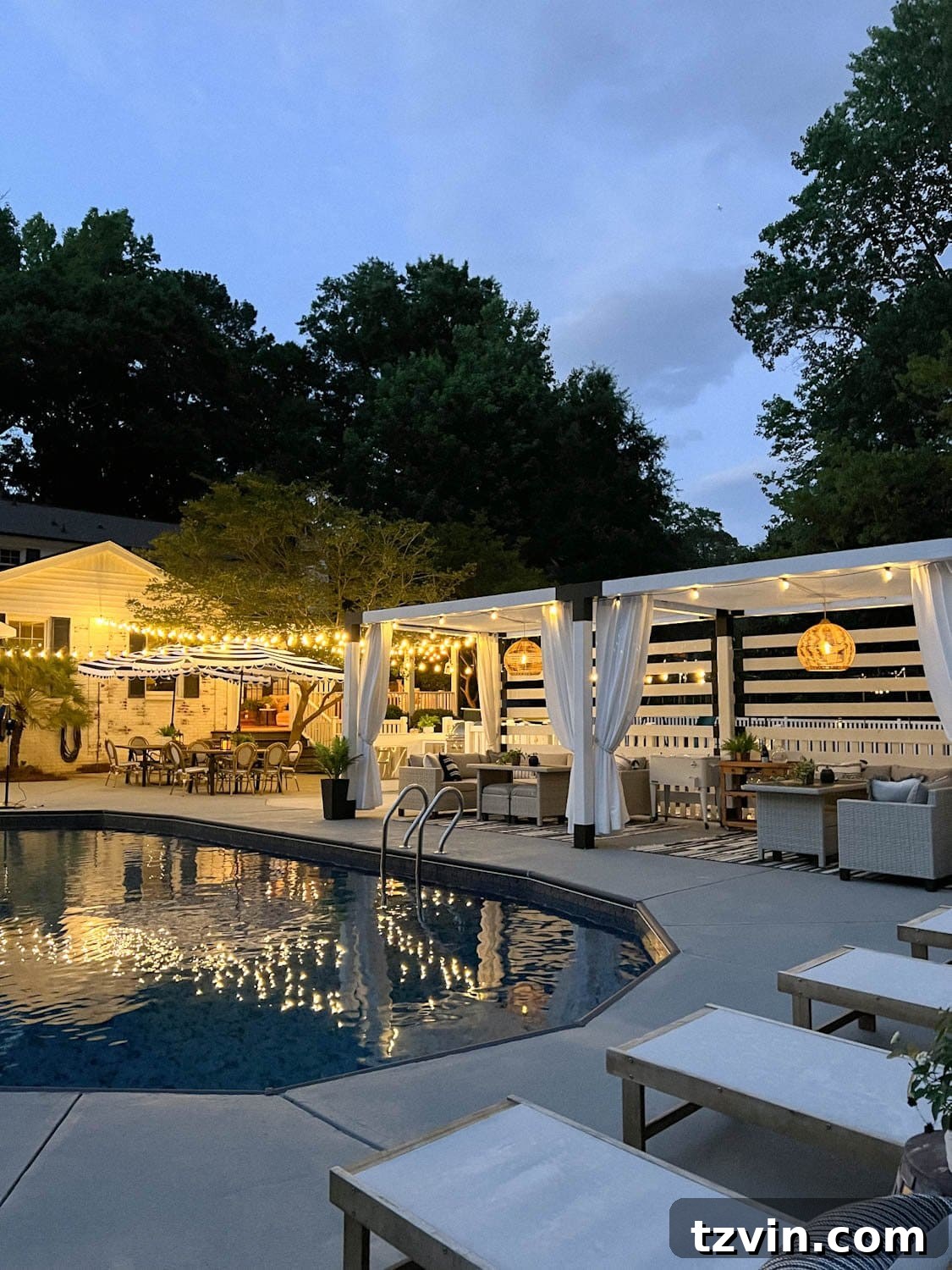 Creative String Light Solutions for Every Backyard Corner 49 string lights around a pool at night with pergola