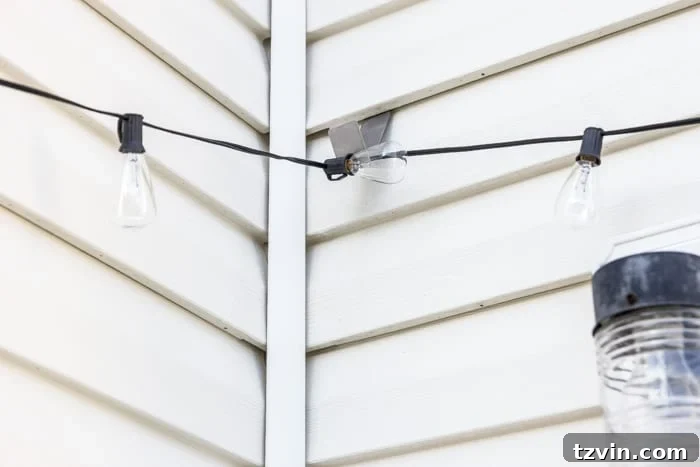 Creative String Light Solutions for Every Backyard Corner 55 string lights hanging from siding clips