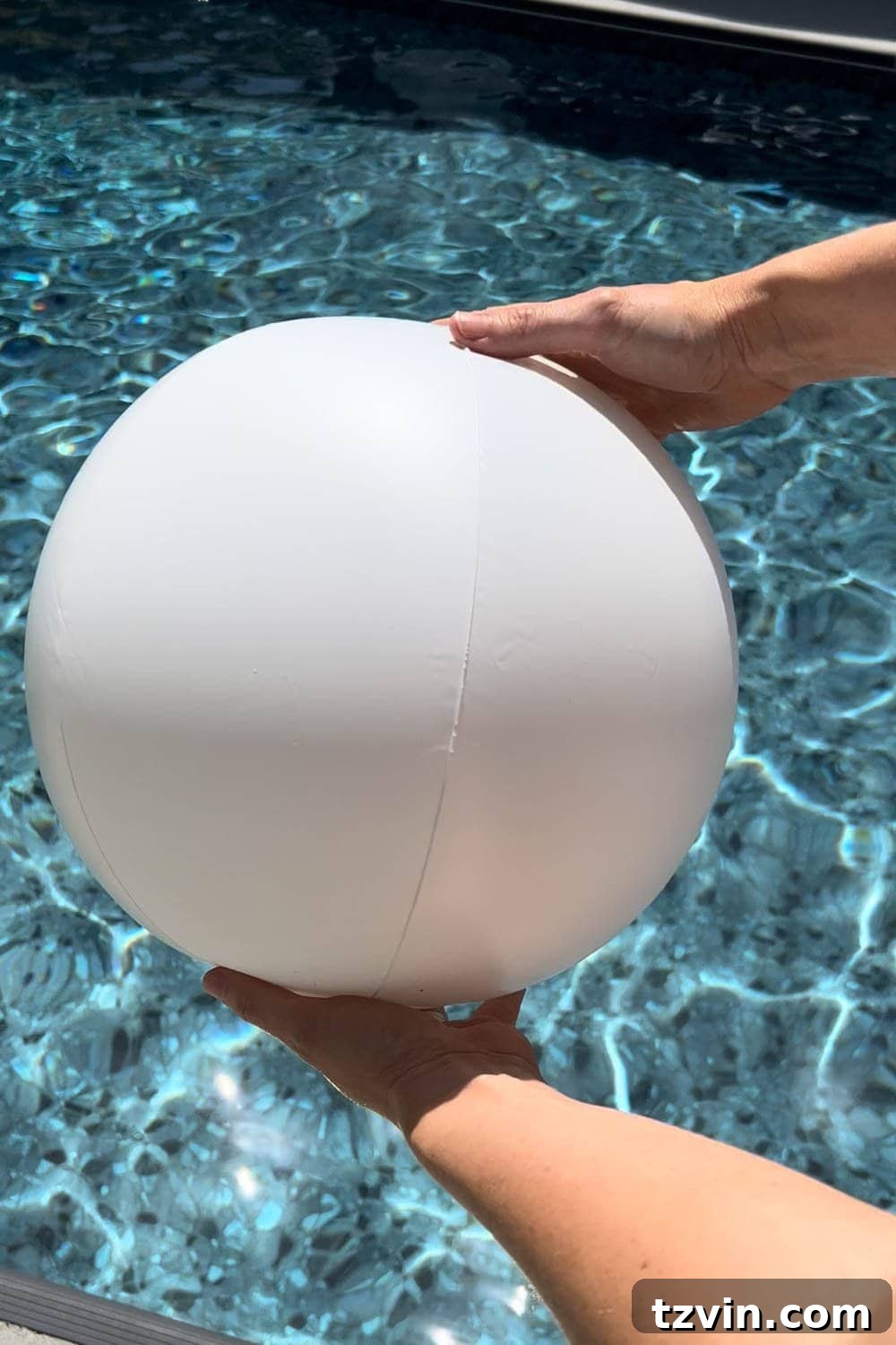 white beach ball over water