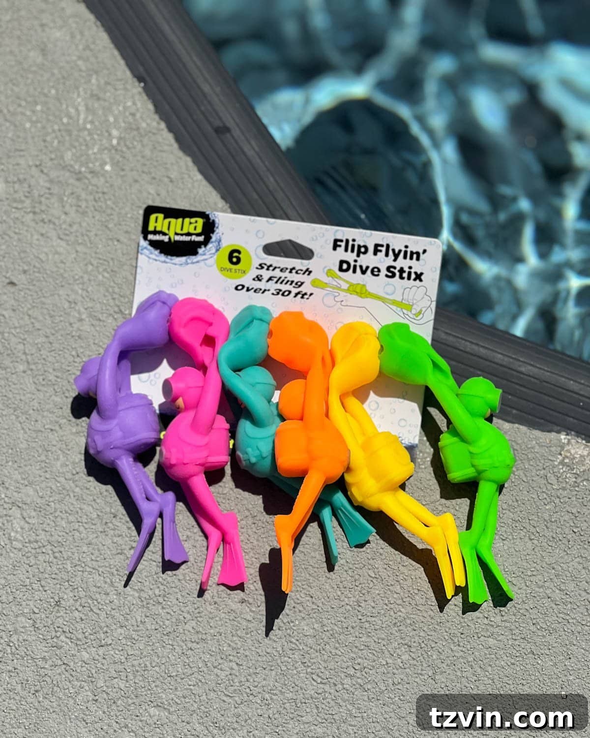 pack of Flip Flying Dive Stix pool toys on the side of a swimming pool