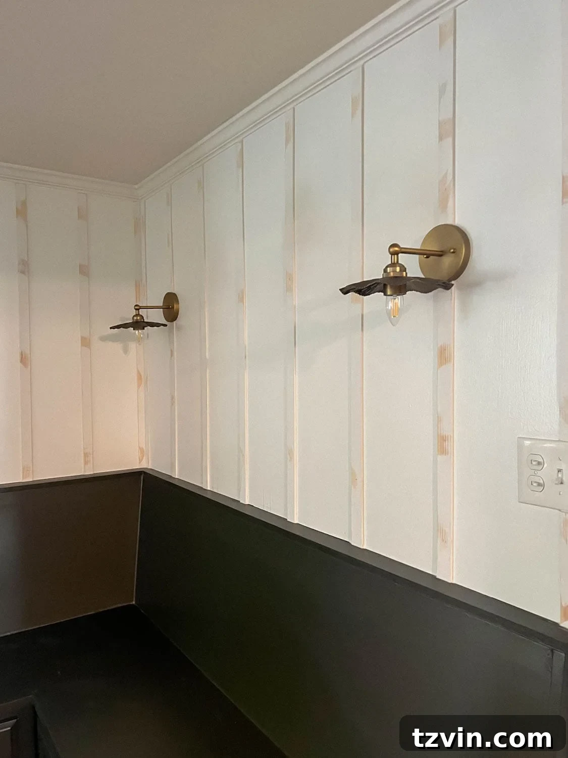 Create a Budget Batten Wall with Lattice Strips 10 A newly installed batten wall, showcasing the smooth finish after caulking, wood filling, and sanding, awaiting its final coat of paint