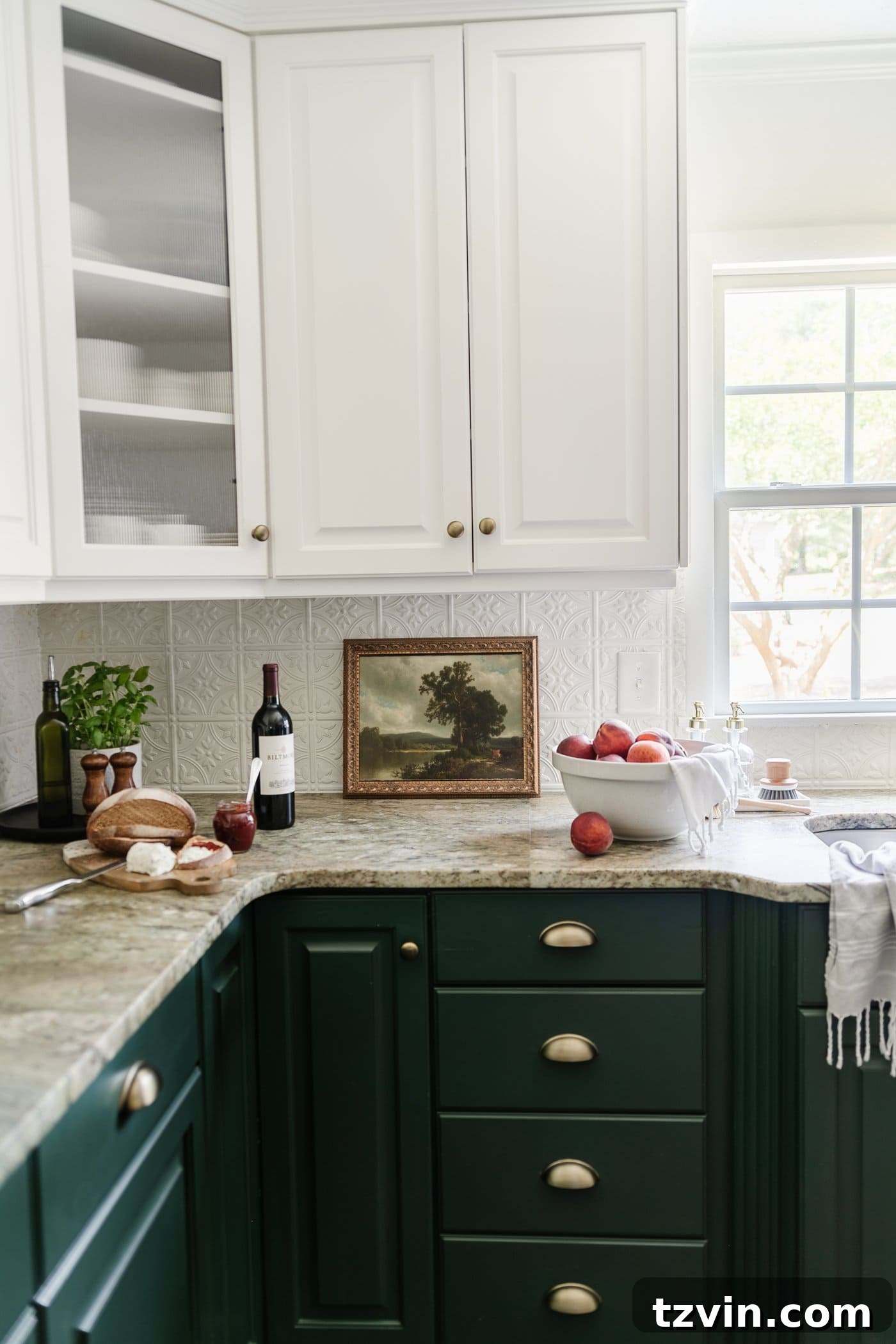 framed landscape oil painting print as kitchen art on a countertop
