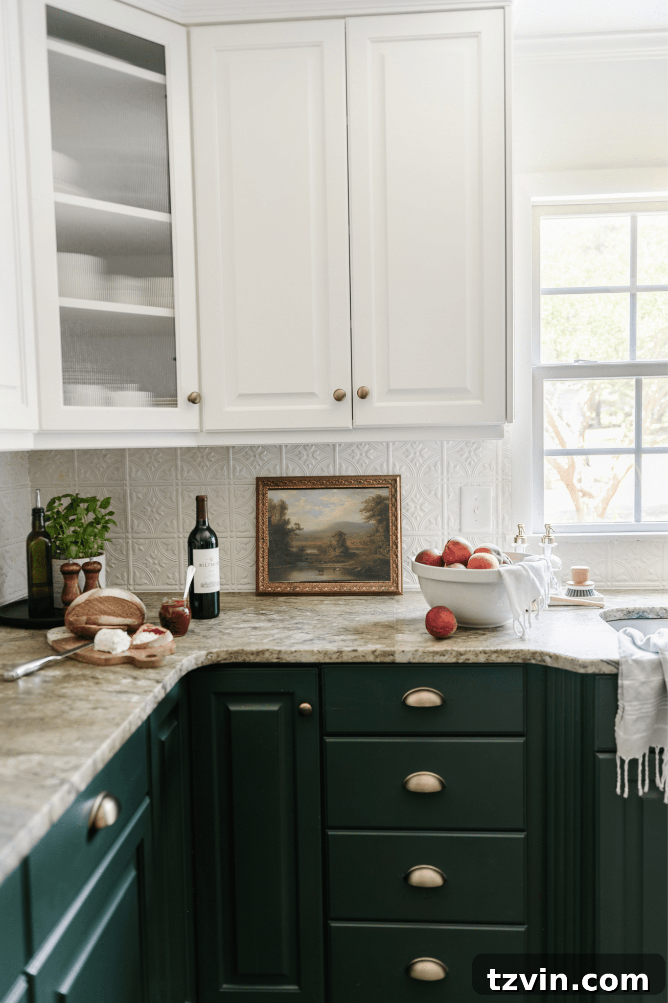 framed landscape oil painting print as kitchen art on a countertop