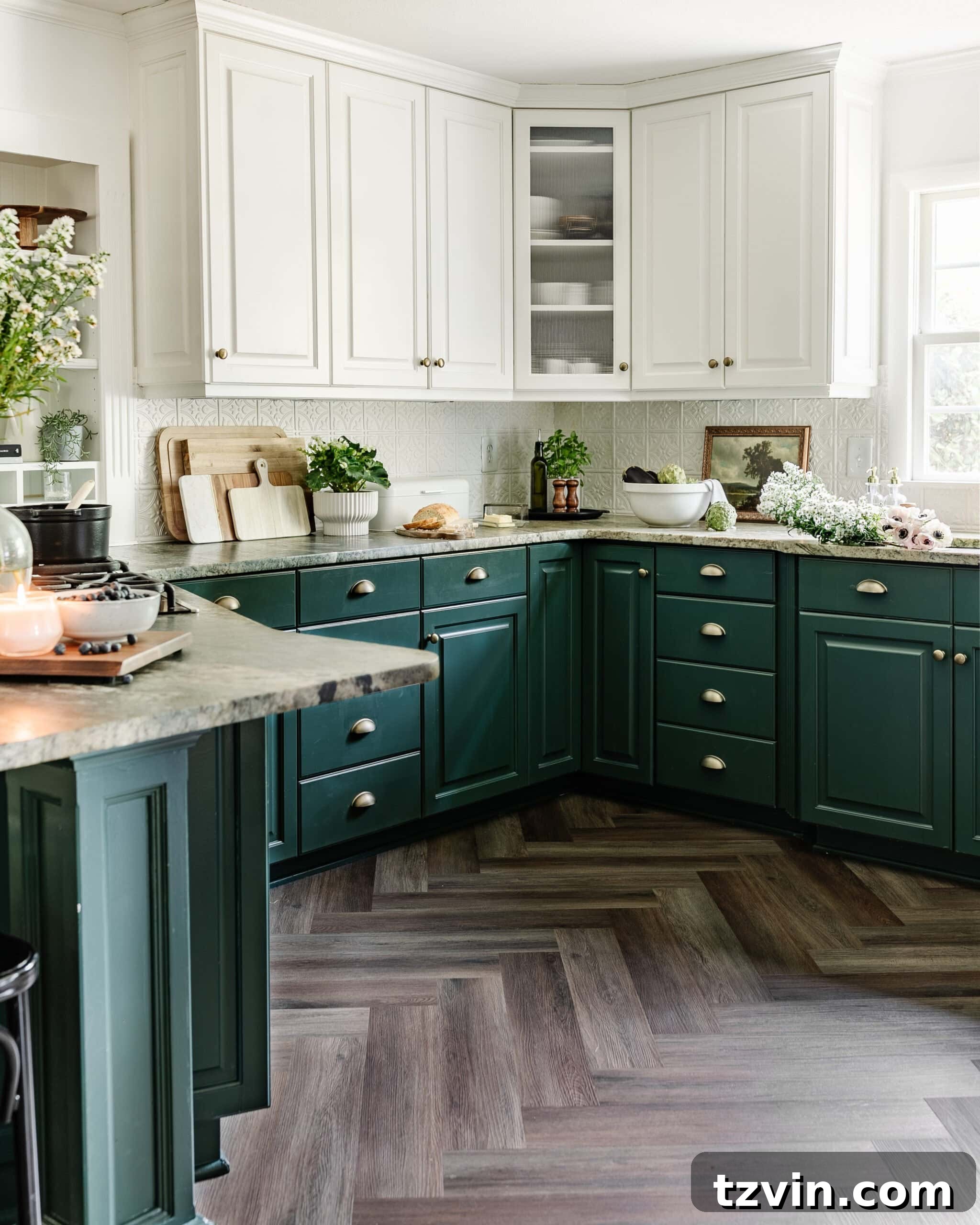 Kitchen and Nook Amazing Makeover 21 Refreshed kitchen featuring stylish green lower cabinets paired with crisp white upper cabinets, all set against elegant herringbone LVP flooring.