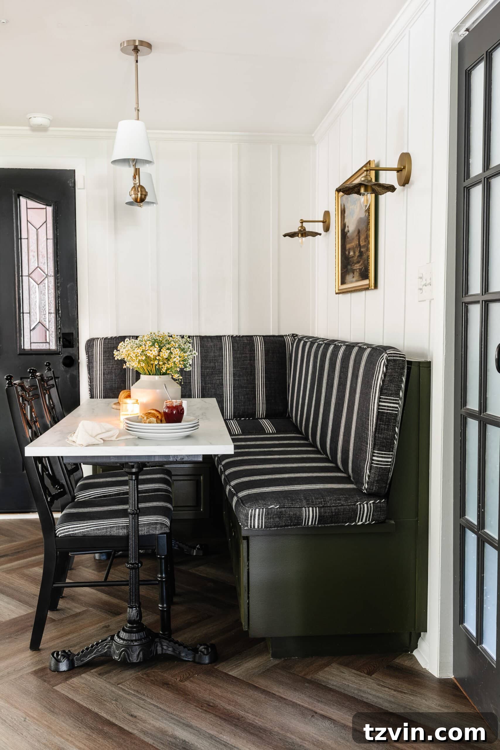 Kitchen and Nook Amazing Makeover 30 Vintage-inspired corner breakfast nook featuring a striped bench and elegant herringbone floors, creating a timeless and inviting space.