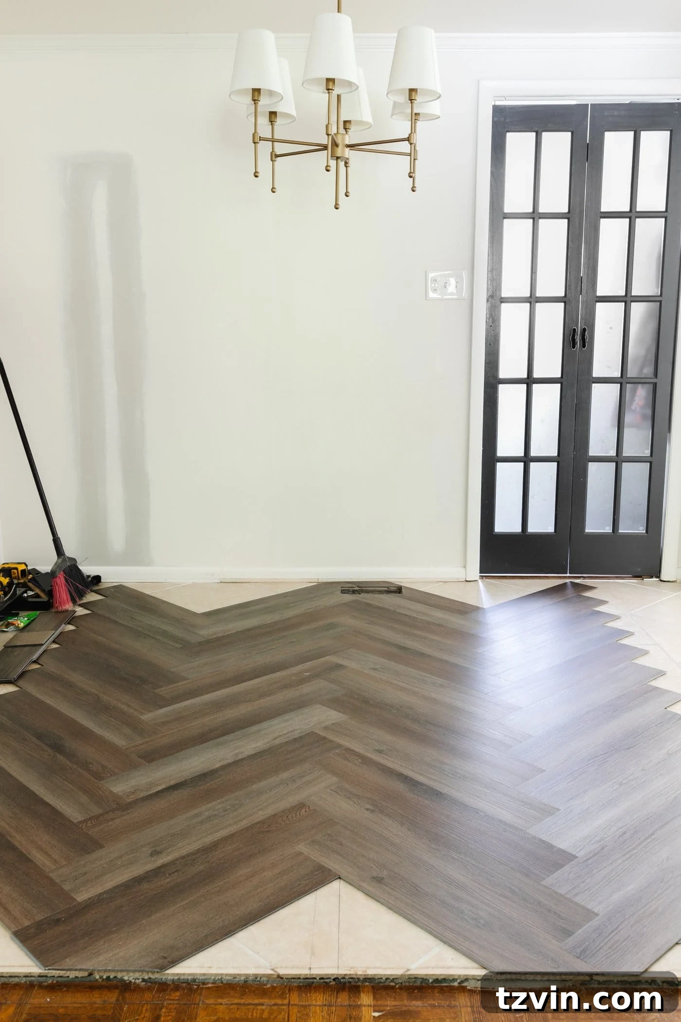 Kitchen and Nook Amazing Makeover 7 Herringbone LVP floating flooring from Procore Floors, showcasing its rich texture and seamless installation over tile.