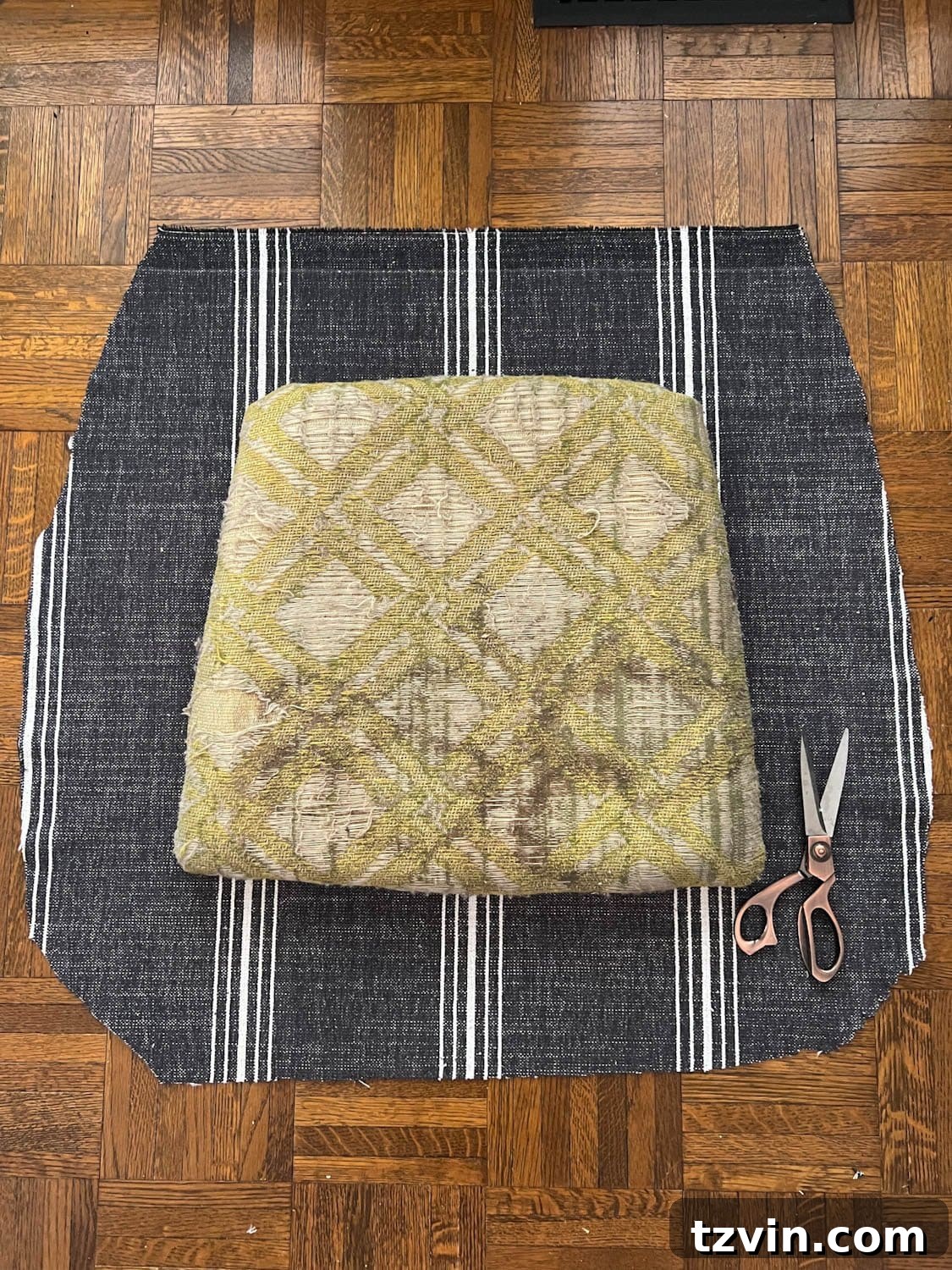 Revitalize Your Dining Chairs Seat Reupholstery and Faux Bamboo Transformation 4 old dining chair seat on cut out upholstery fabric