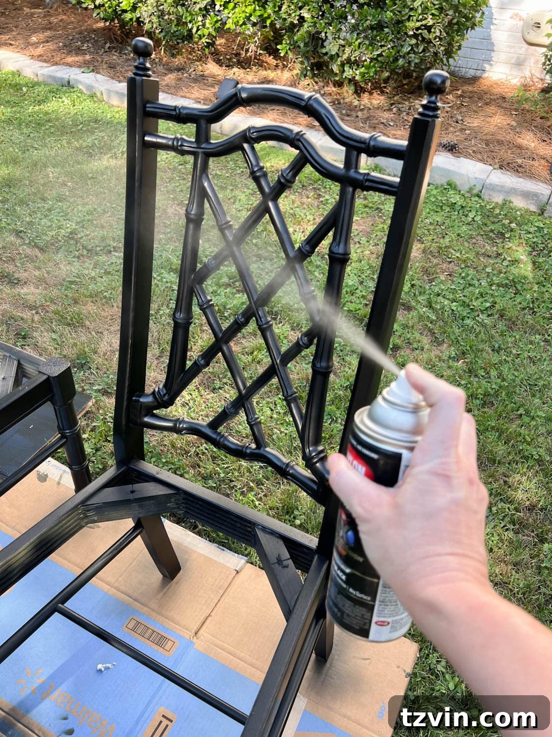Revitalize Your Dining Chairs Seat Reupholstery and Faux Bamboo Transformation 10 spray painting a bamboo chair with black paint