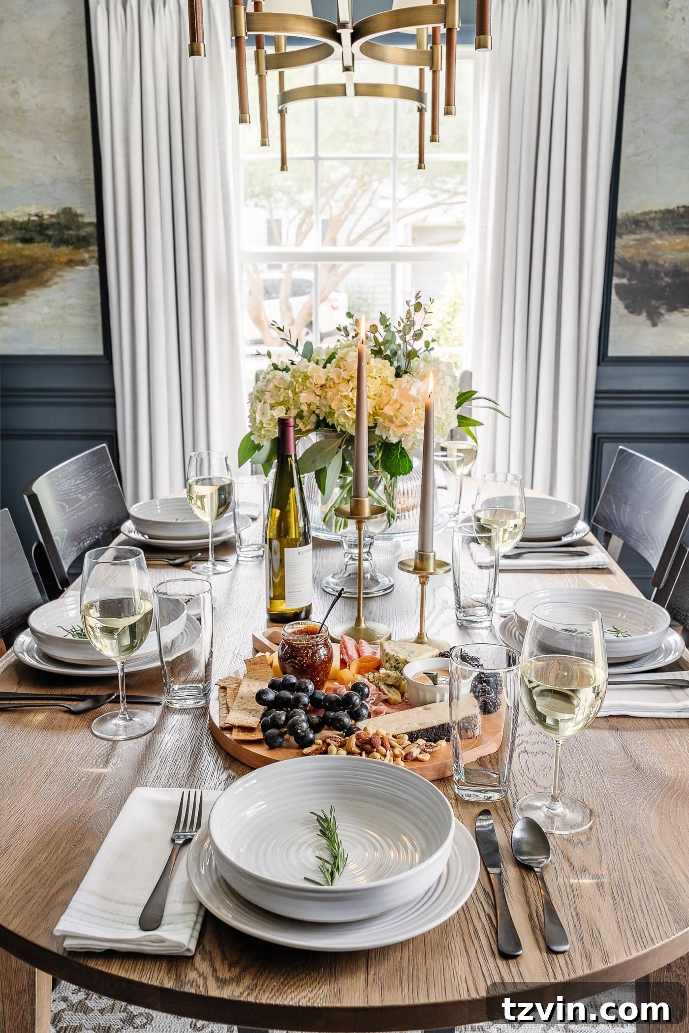 Effortless Table Settings for Every Occasion 5 summer dinner table setting with charcuterie board and simple flower centerpiece