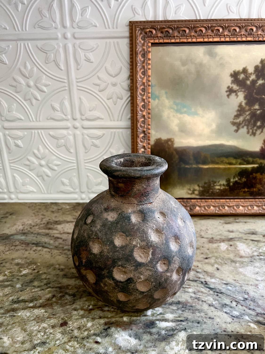A close-up shot of a unique terracotta vase, perfect for a DIY lamp project, highlighted against a soft background.