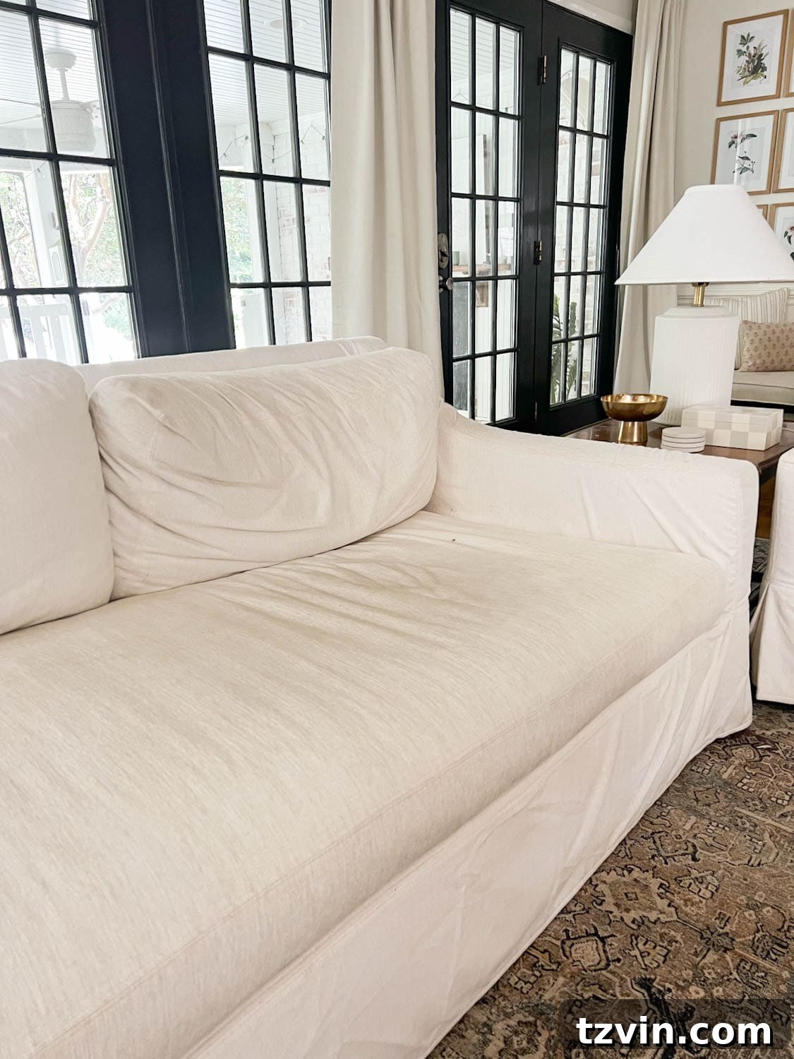 Before photo of a Pottery Barn couch with Sunbrella fabric, showing signs of wear and dirt accumulation prior to DIY cleaning.