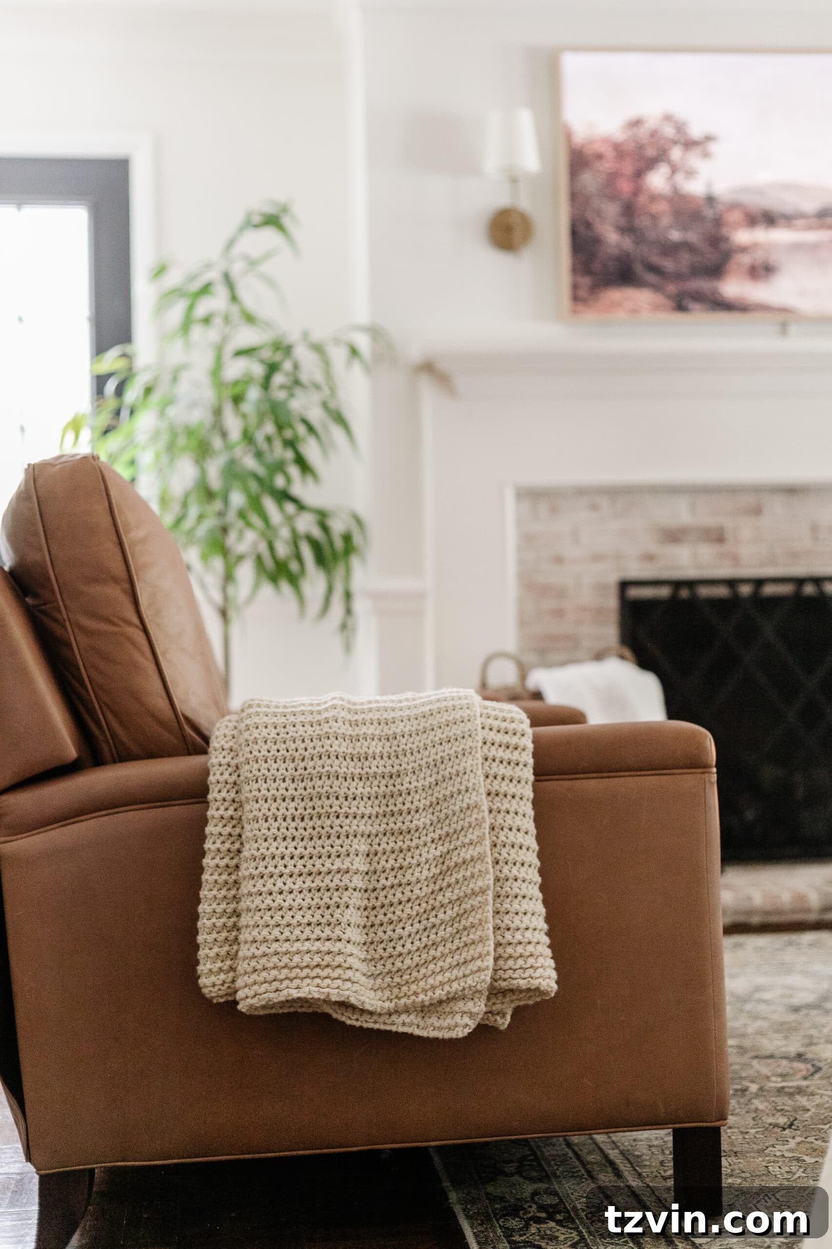 Effortless Autumn Living Room Decor for Less 18 Leather recliner with knit throw blanket in a living room for fall decor
