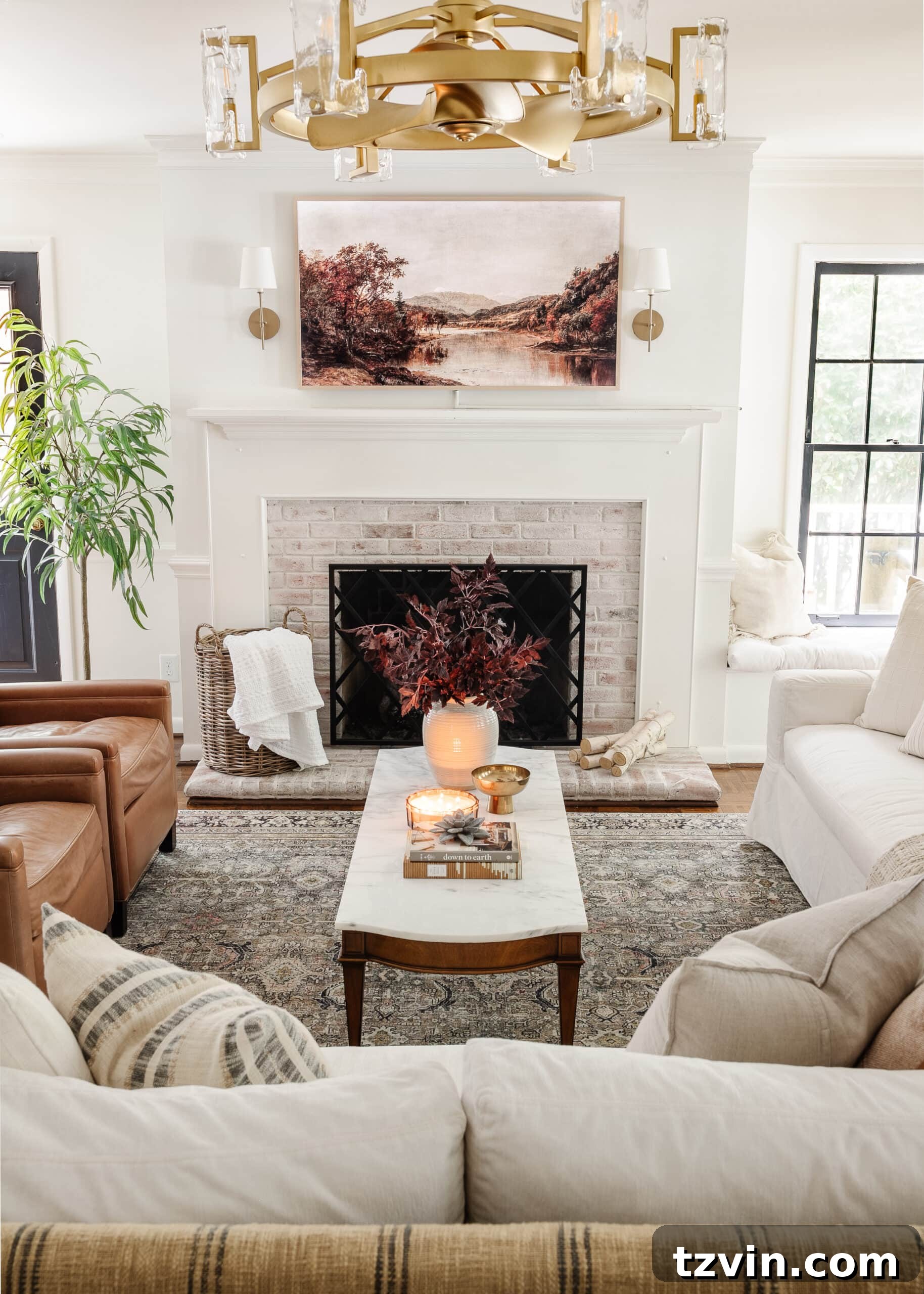 Effortless Autumn Living Room Decor for Less 3 Fall living room decorating ideas using soft lighting, fall art, fall leaves, and neutral pillows