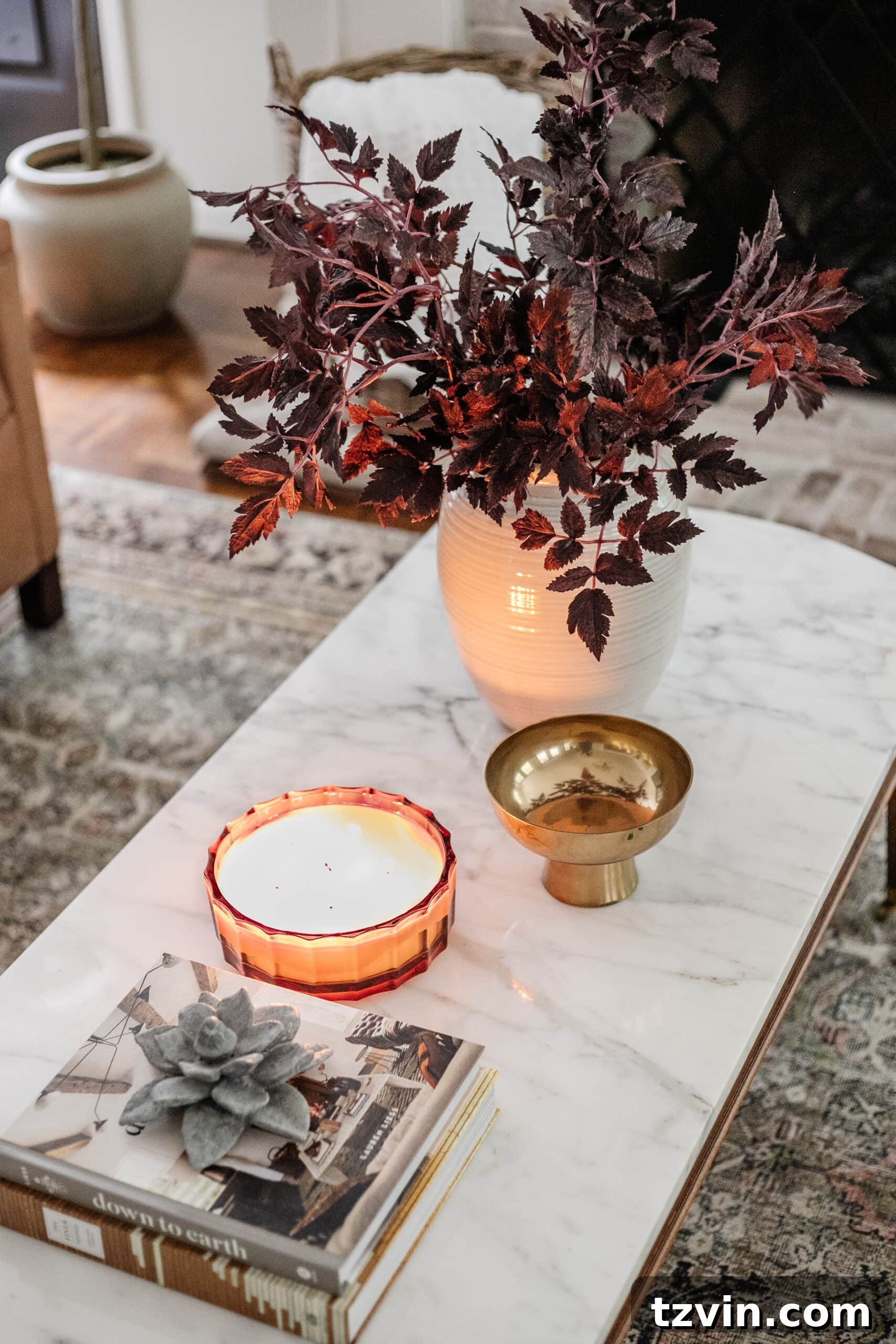 Effortless Autumn Living Room Decor for Less 22 Fall coffee table decor with vase of fall stems, candle, bowl, and books