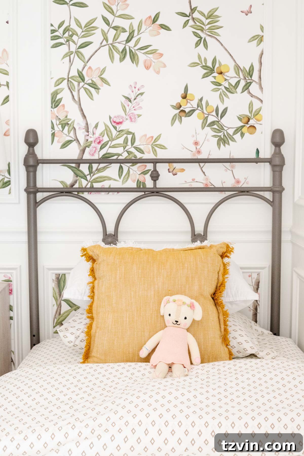 Retro Wallpaper Magic for Teen Hangouts and Kids Play Paradises 6 Elegant chinoiserie wallpaper adorning a child's bedroom, featuring sophisticated picture frame molding and a charming metal bed.