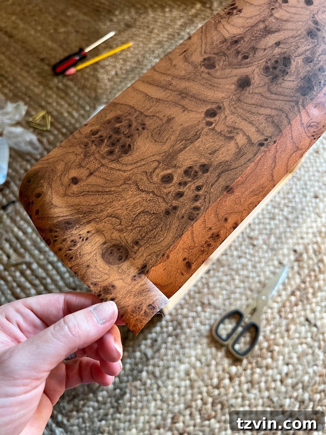 cutting excess contact paper for furniture wrapping